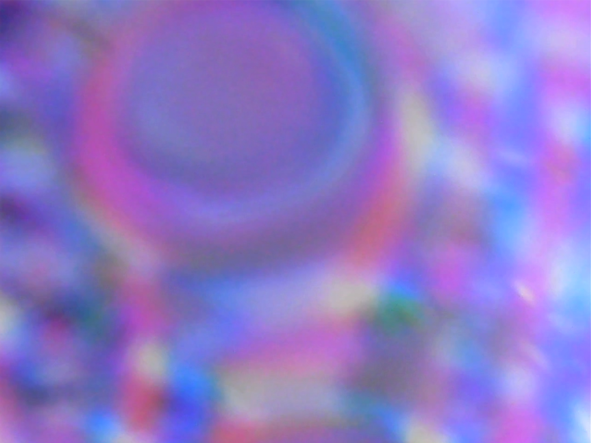 A digital image of an oily fluid from above.