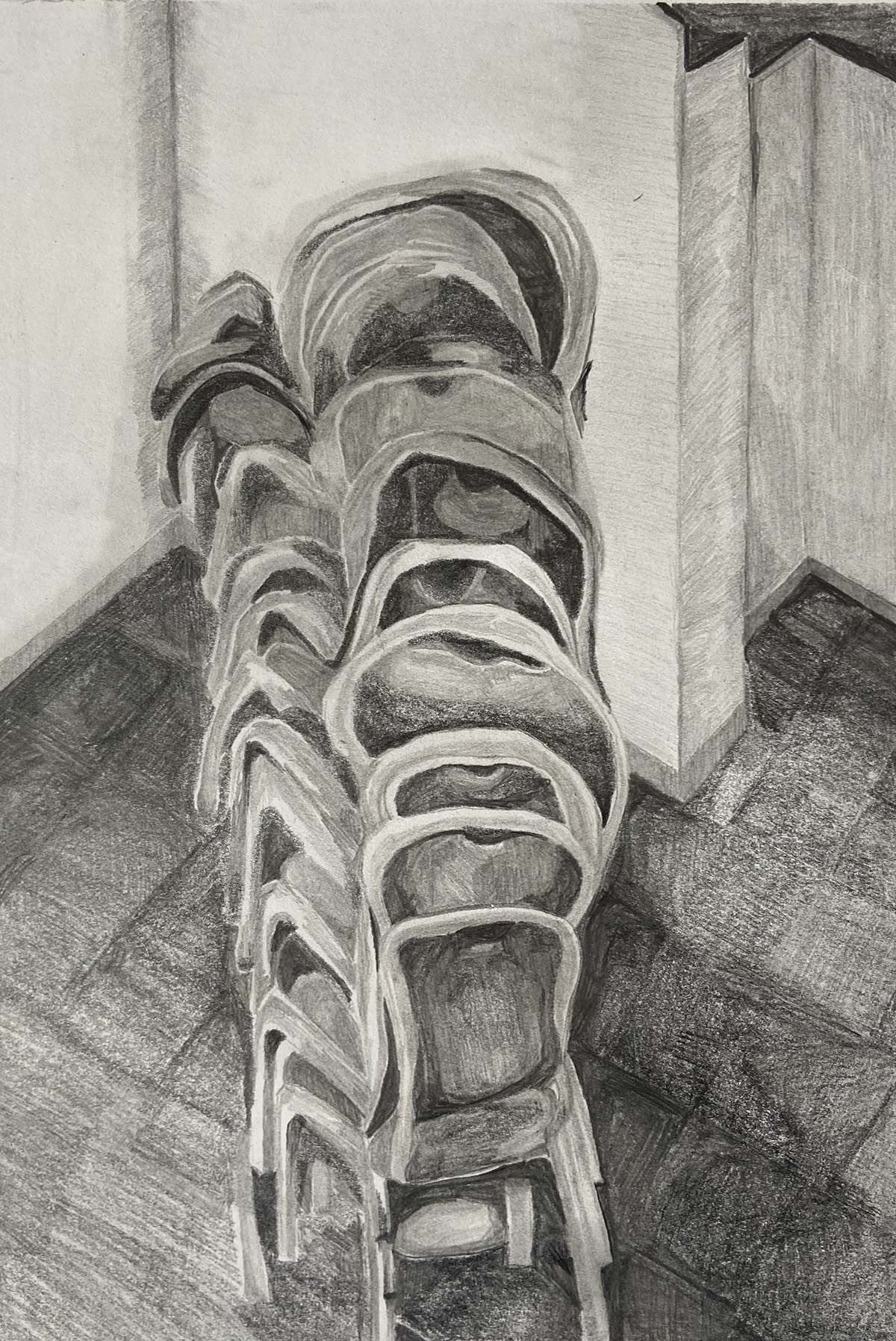 A pencil drawing of a stack of chairs.