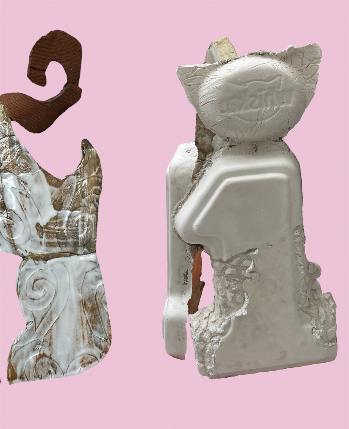 Two pictures of a cat-like sculpture against a pink background.