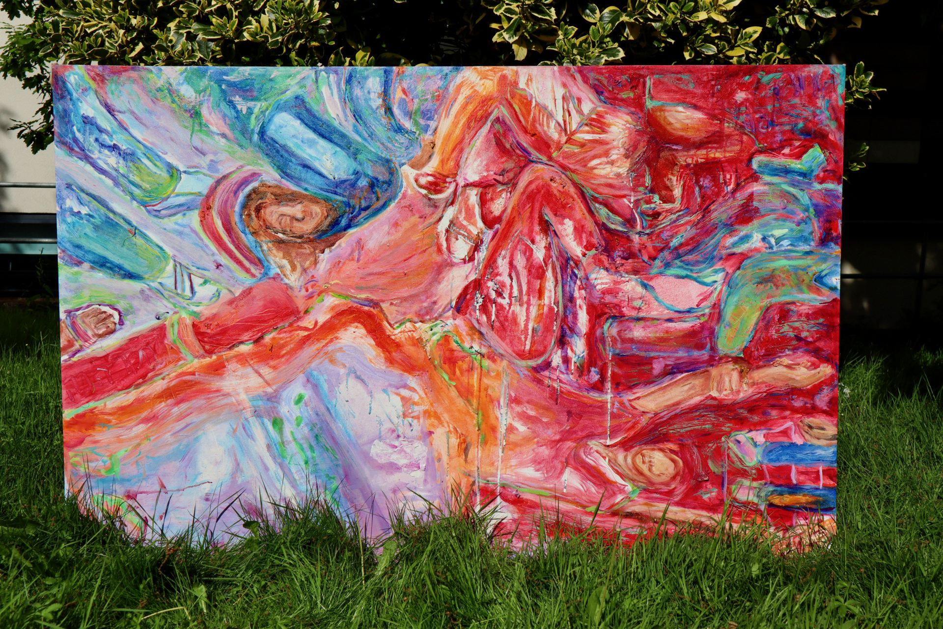 an abstract oil painting of a reclining figure, in red, green, pink and blue.