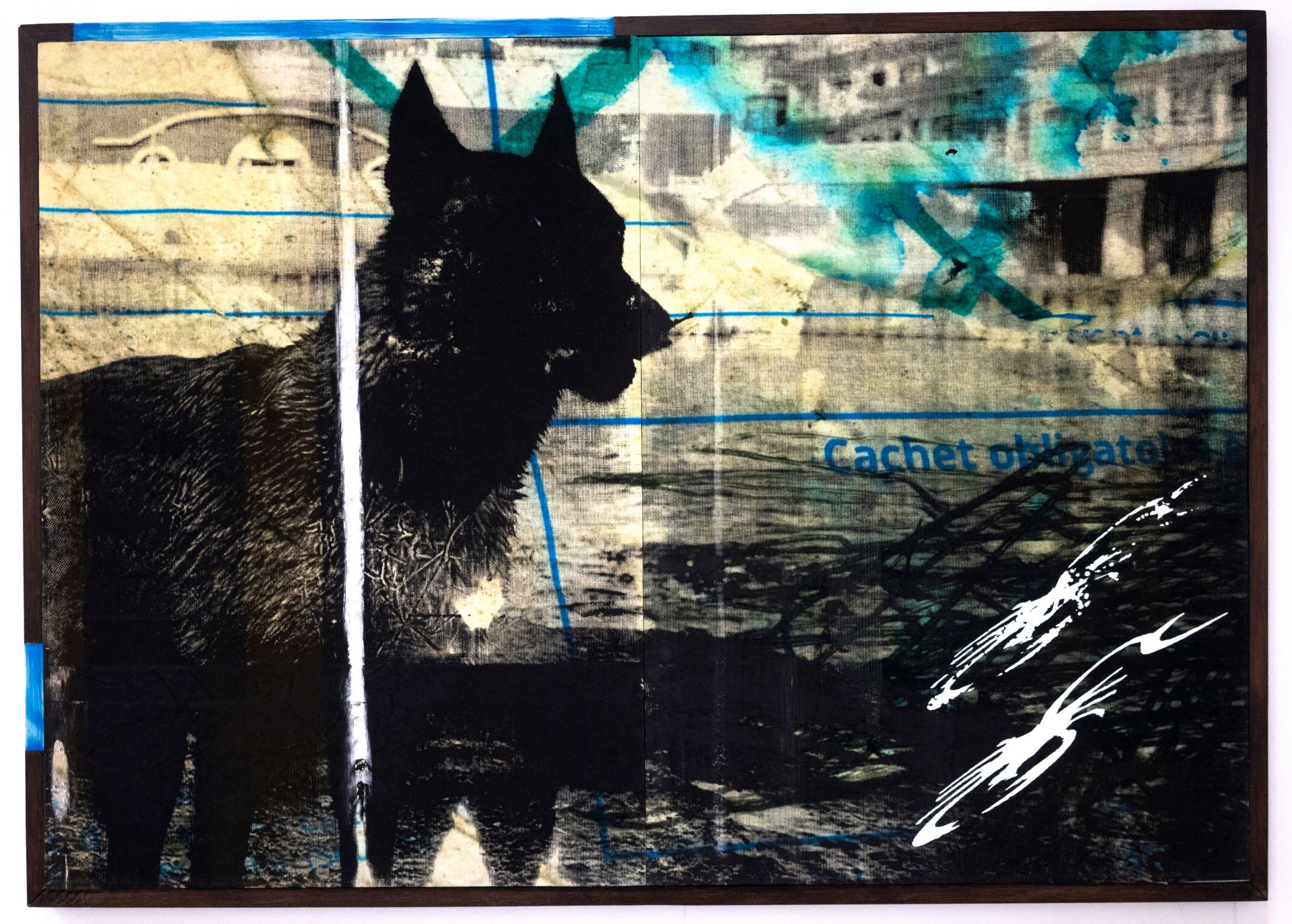 A black print of a dog against a photographic background.