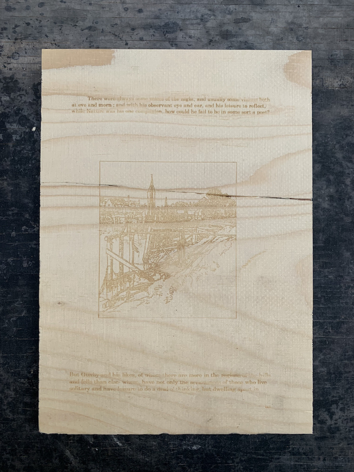 An image of a building, laser-etched on plywood.