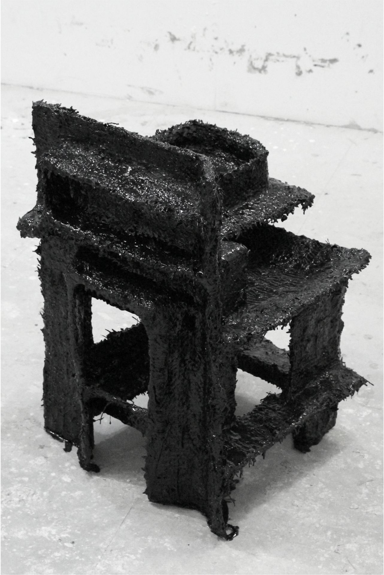 An abstract, black sculpture.