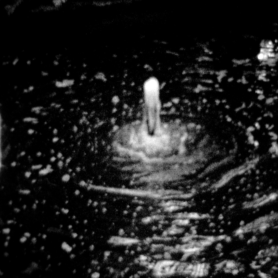 An abstract image of a fountain taken with a super-8 camera.