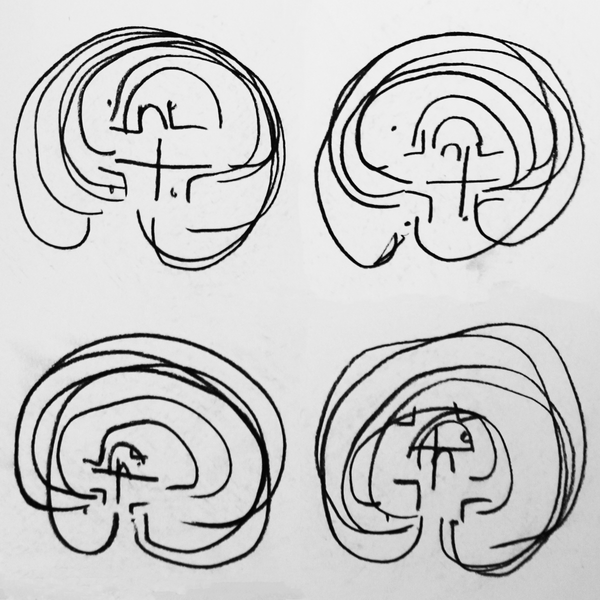 Four charcoal drawings of classic labyrinths in a 2x2 grid. The drawings have been done without looking at the paper, giving a disjointed and messy appearance.