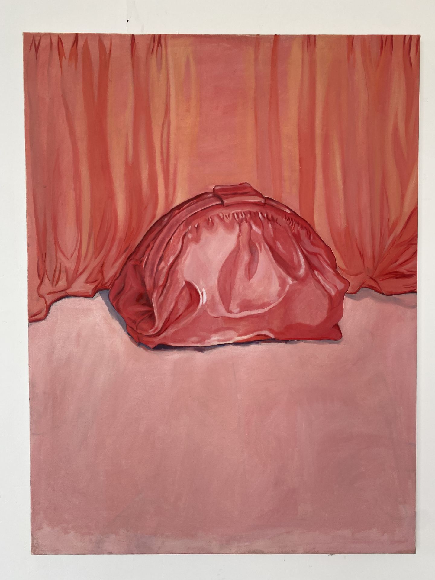 An oil painting of a pink bag against a pink, curtained background.