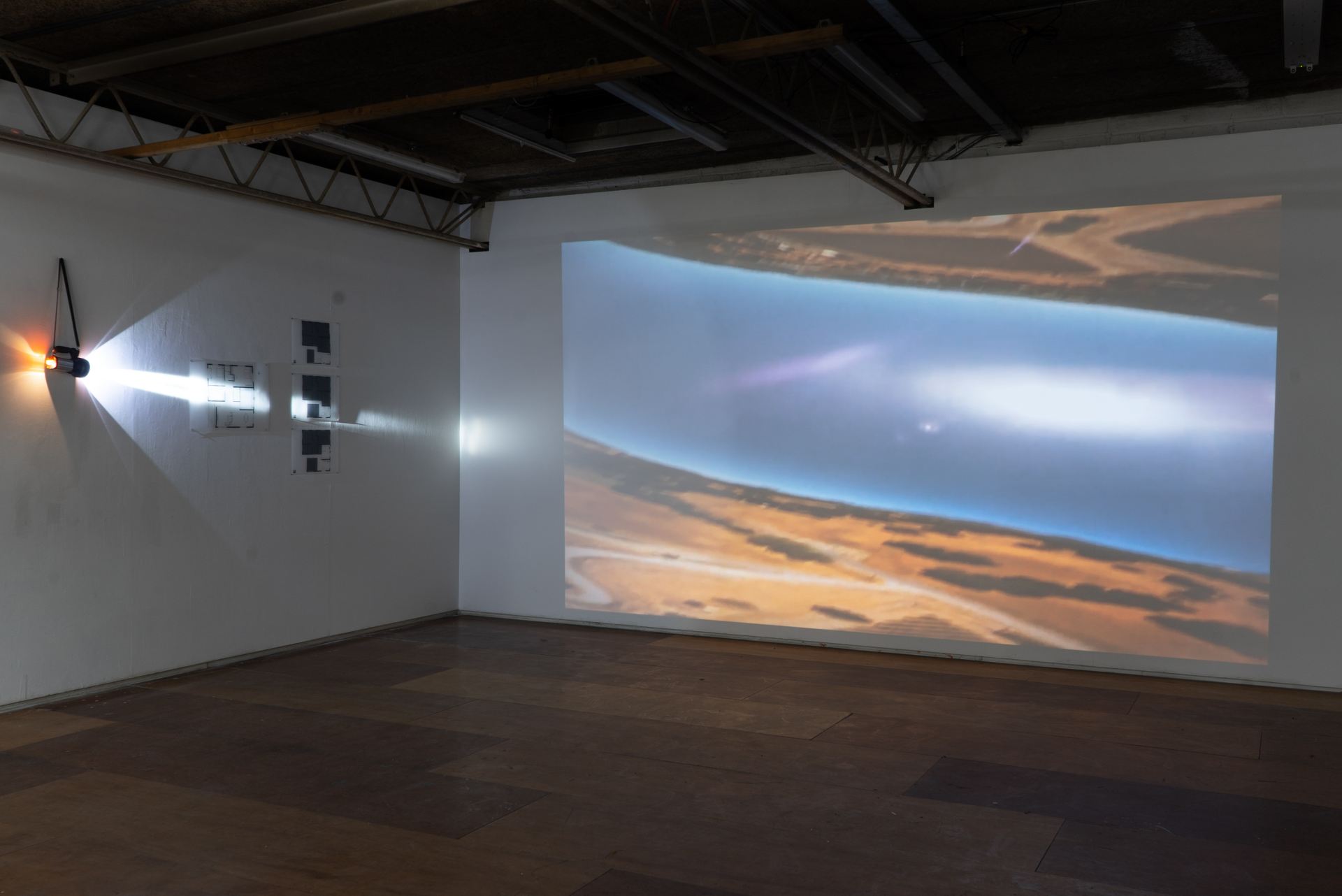 An image of a landscape projected on a wall.