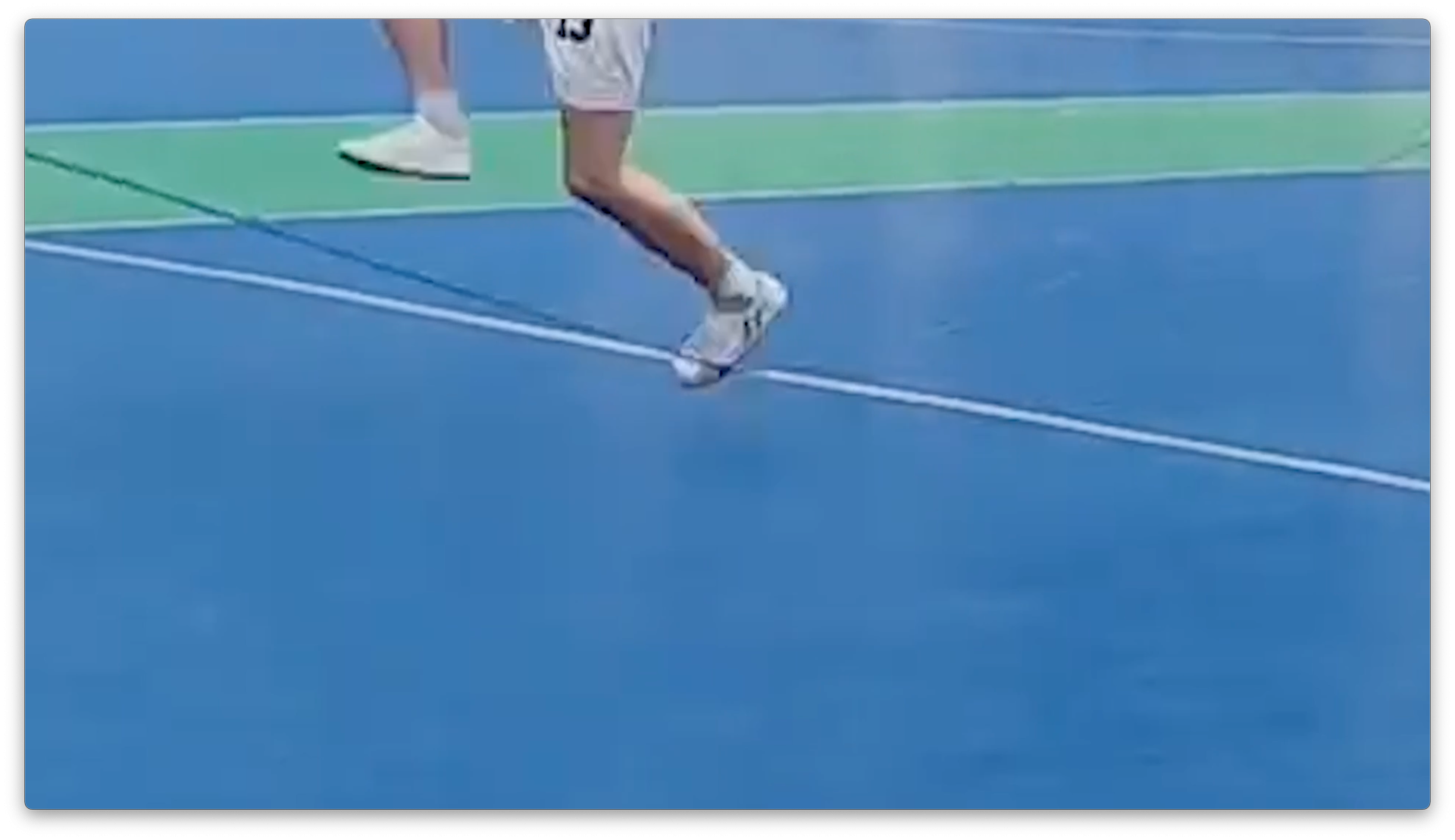 An image of a tennis player's legs jumping.