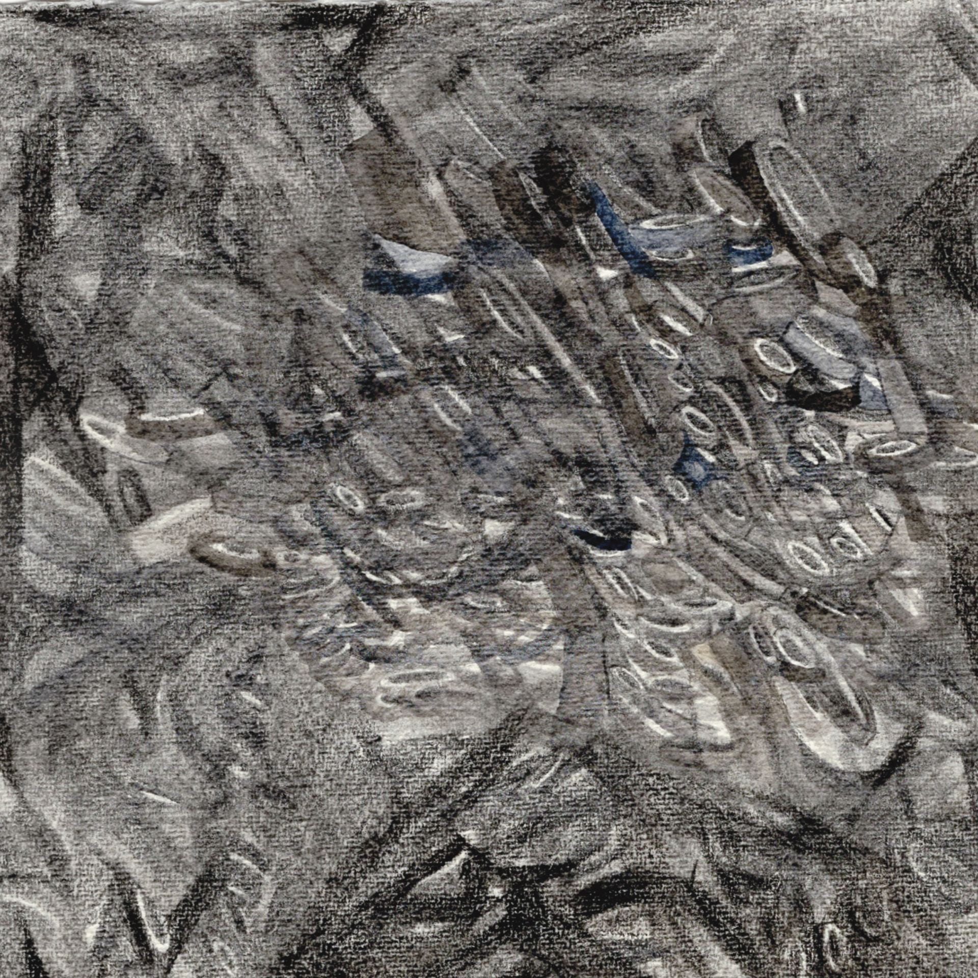 An image of a scribbled, graphite surface.