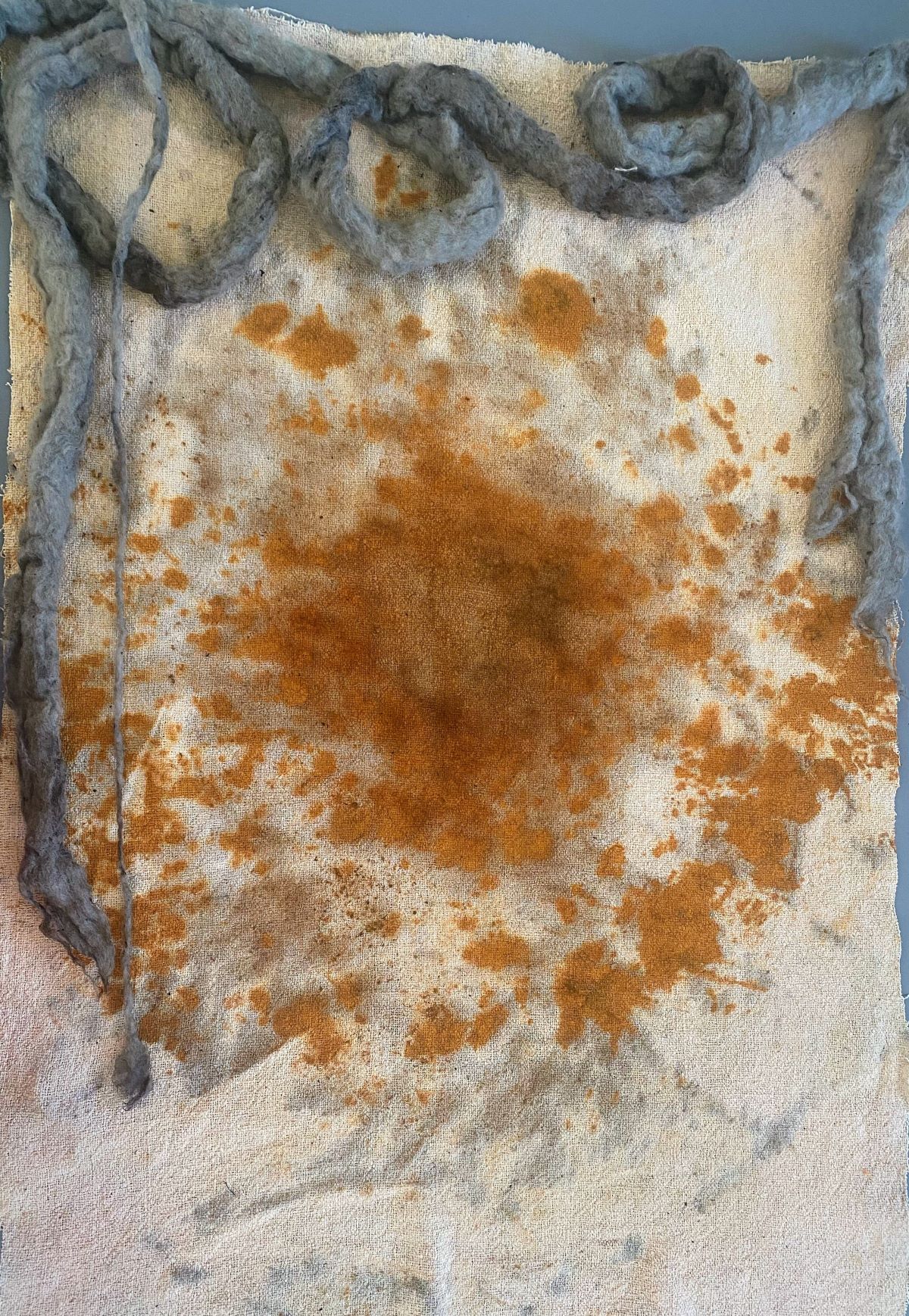 An image of some fabric dyed with rust.