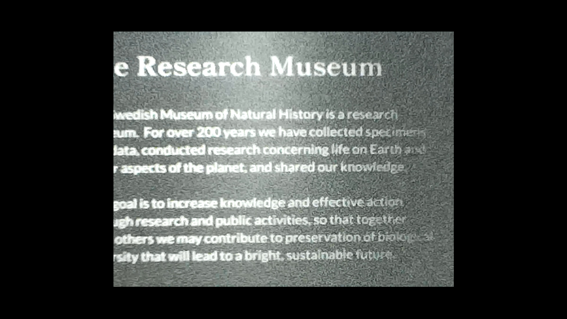 A greyscale image of a museum notice.