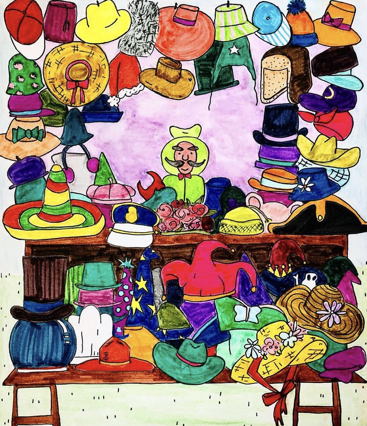 A man in a hat is surrounded by lots of hats