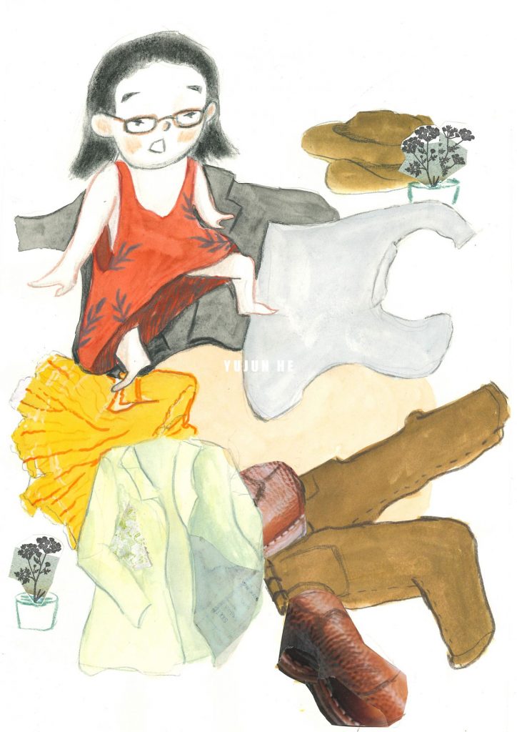 A girl sits on a pile of clothes