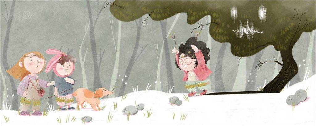 A girl and boy with bunny ears look at a girl holding sticks above her head. The dog holds a stick in its mouth.