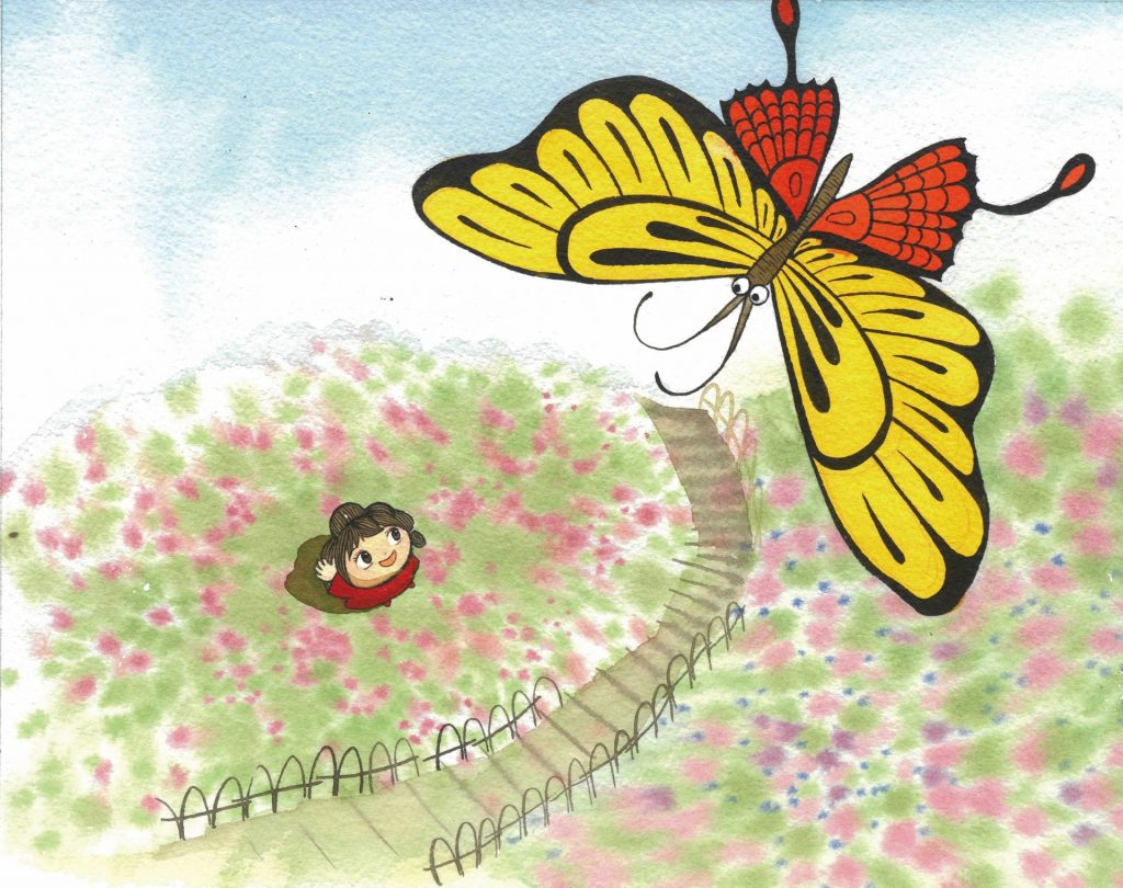 A girl looks up at a butterfly flying over her