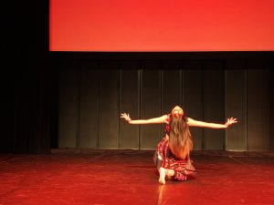 Photo of Yiyun performing Hair Swinging Dance in France