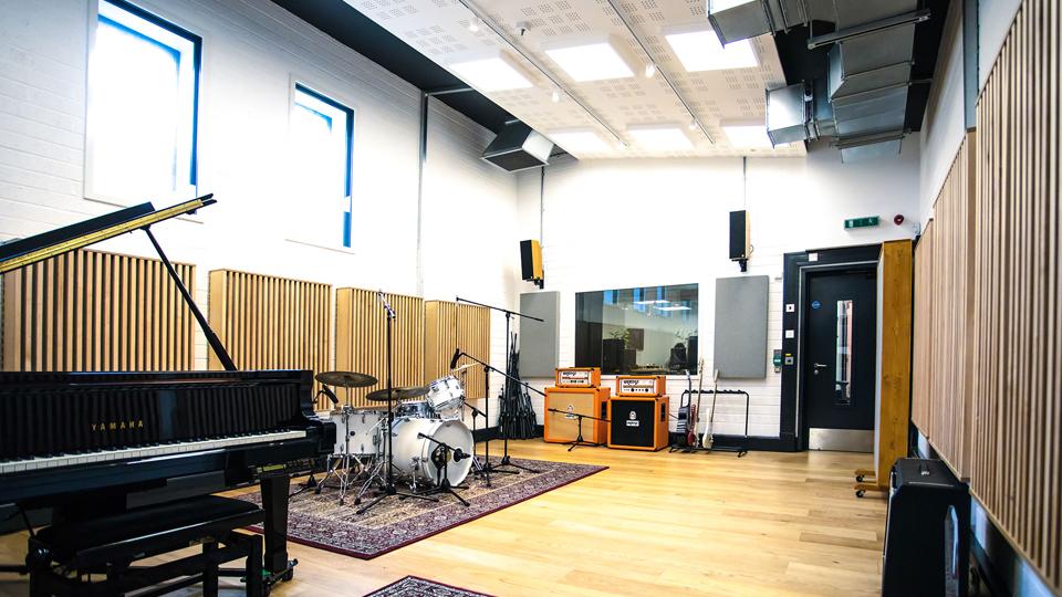 Goldsmiths Music Studio, Studio 1. Containing a grand piano, a drum kit and several guitar amps