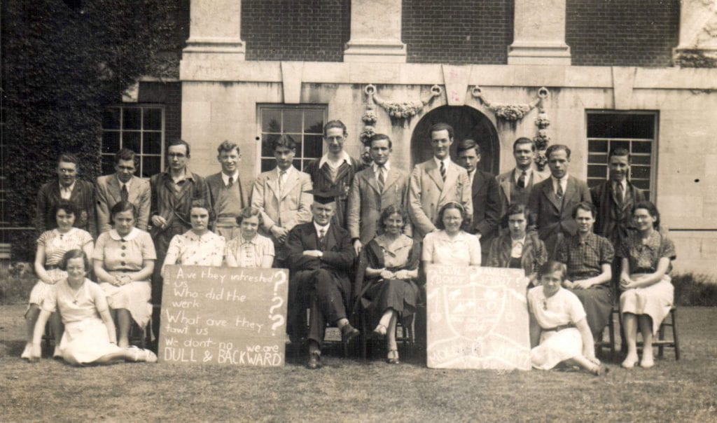 Advanced History group in front of the Blomfield building in 1938. Two women students in the front row playfully mock their supposed ‘Advanced’ status by chalking on a blackboard the deliberately misspelt ‘Are they intrested in us? Who did the werk? What ave they tawt us? We don’t know. We are DULL & BACKWARD’