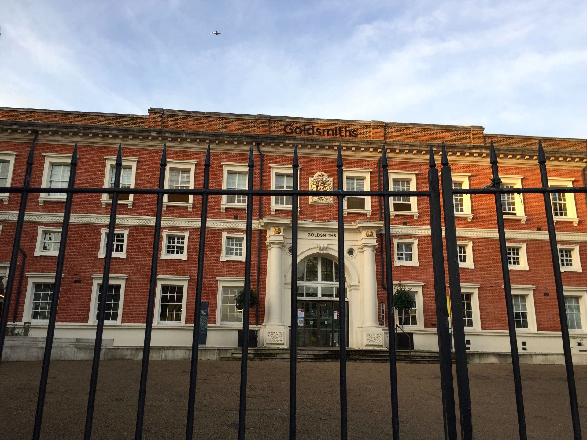 Picture of the front of Goldsmiths, University of London with the gates closed.