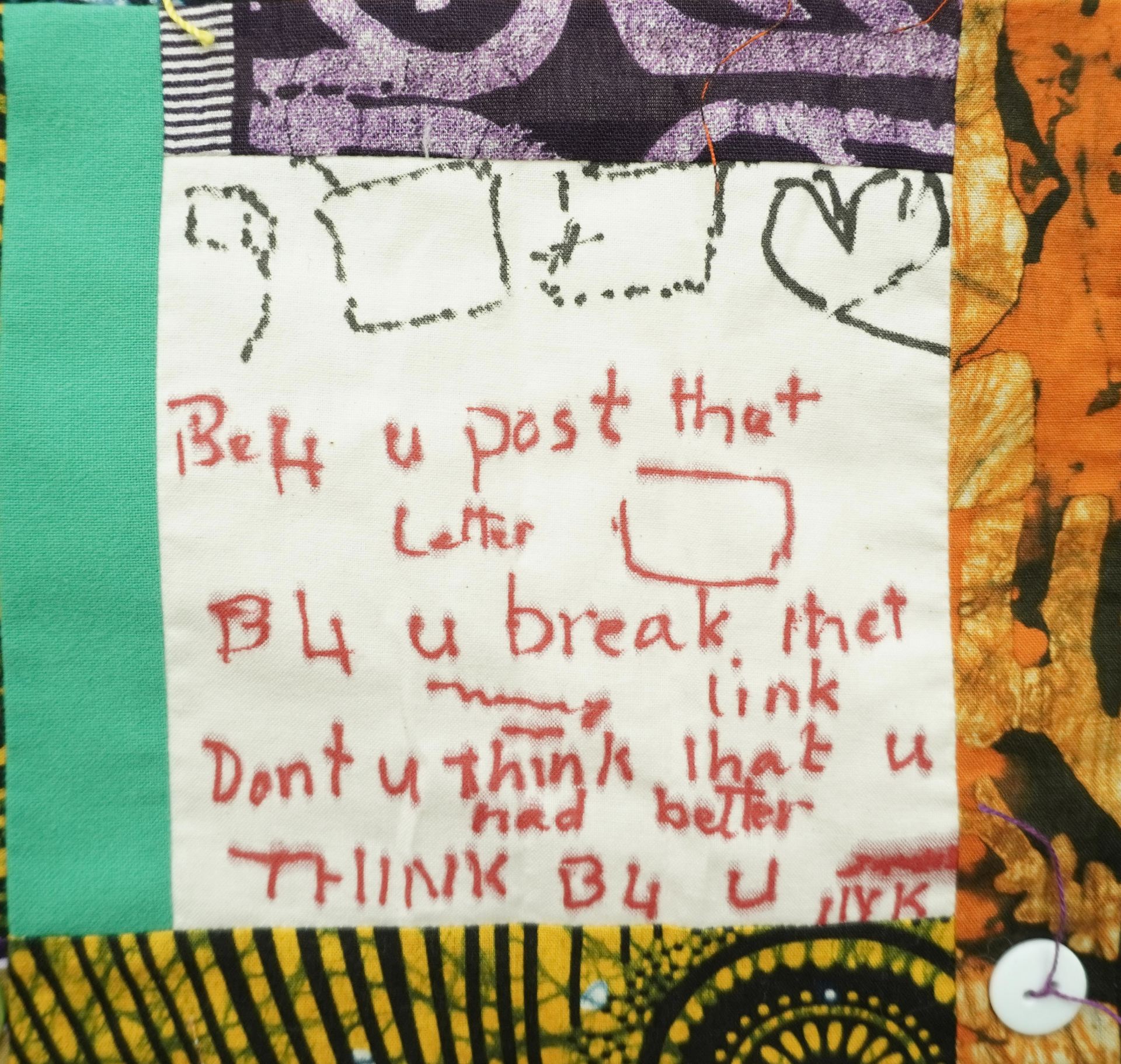 Commemorative quilt. Text reads, 'Before you post that letter, Before you break that link, Don't you think that you had better think before you ink'