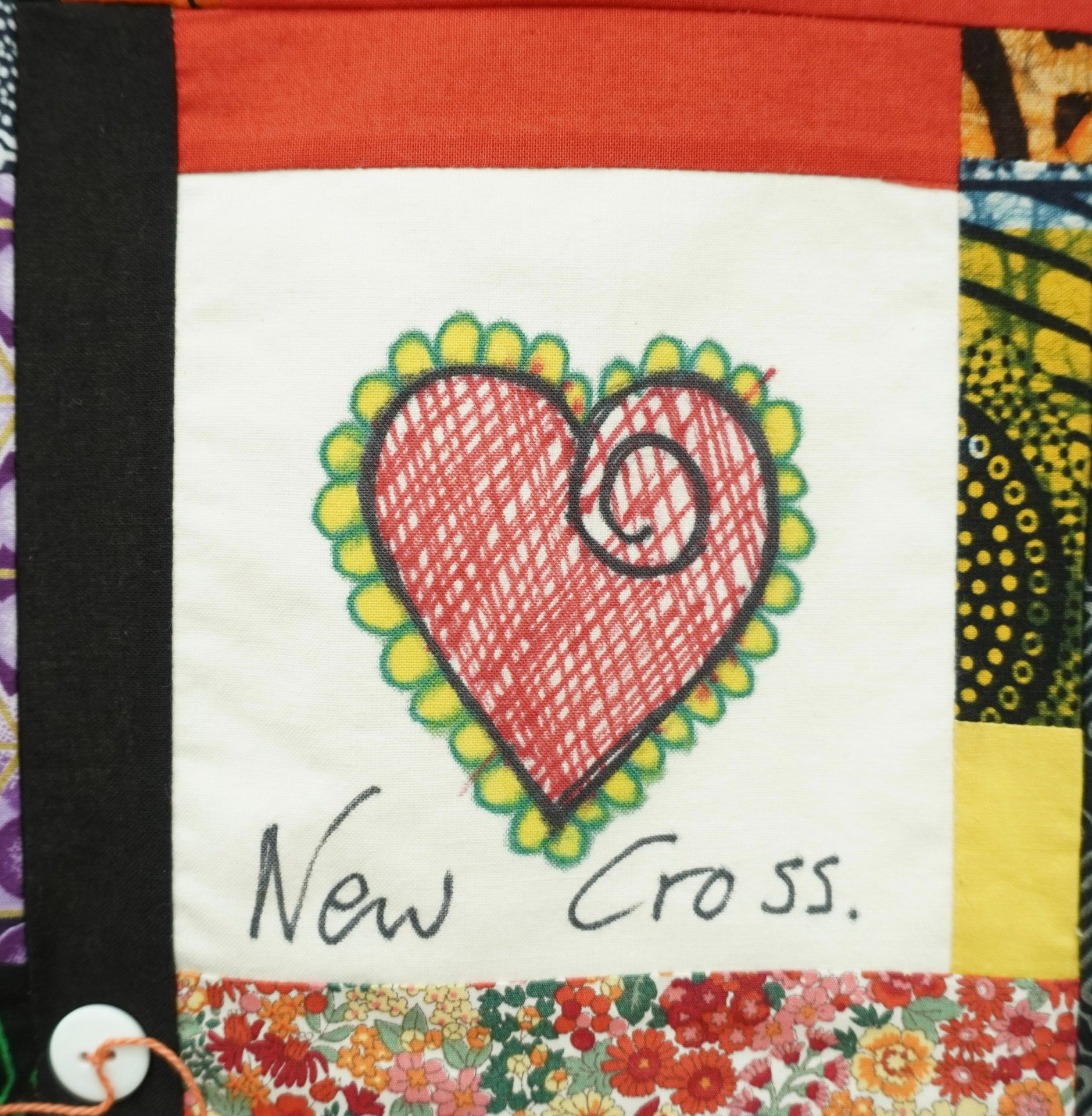 Commemorative quilt. Text reads, 'New Cross'