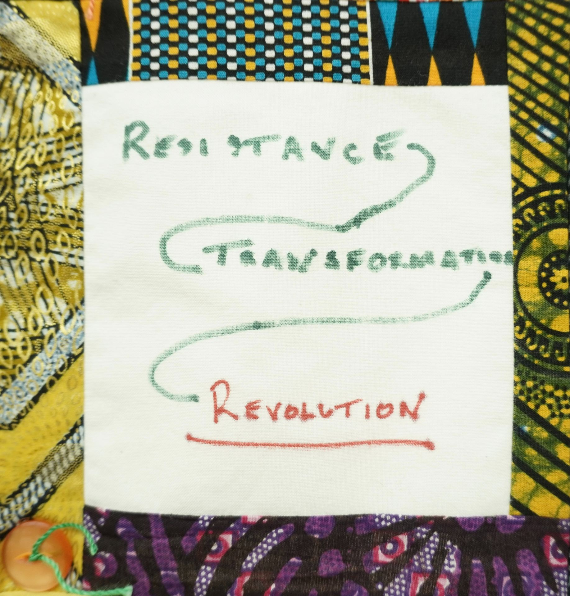 Commemorative quilt. Text reads, 'Resistance, Transformation, Revolution'