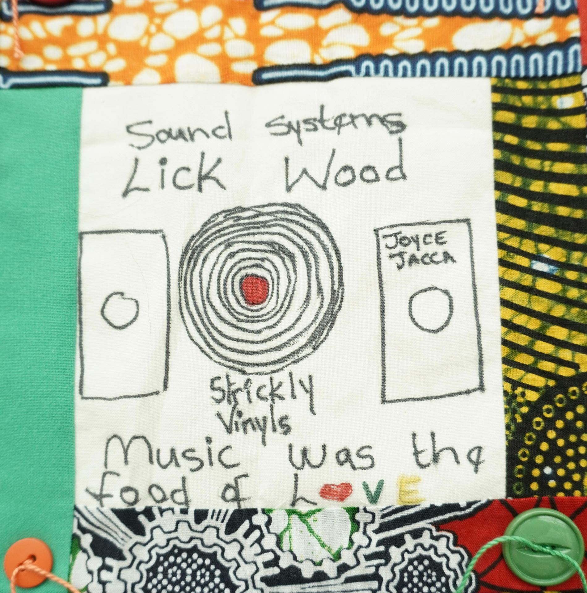 Commemorative quilt. Text reads, 'Sound systems Lick Wood, Joyce Jacca, Strictly Vinyls, Music was the food of love'