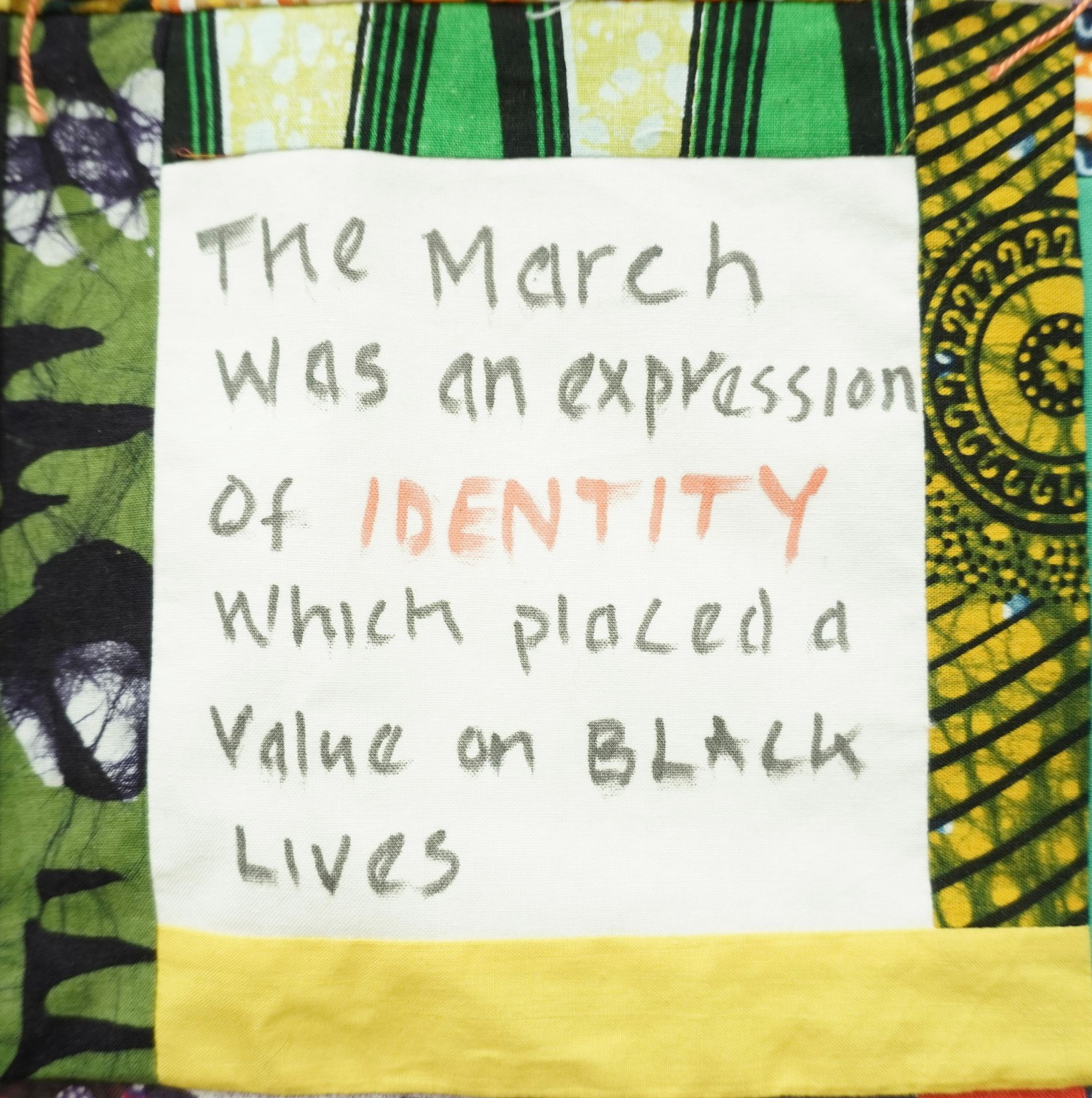 Commemorative quilt. Text reads, 'The march was an expression of identity which placed a value on black lives'