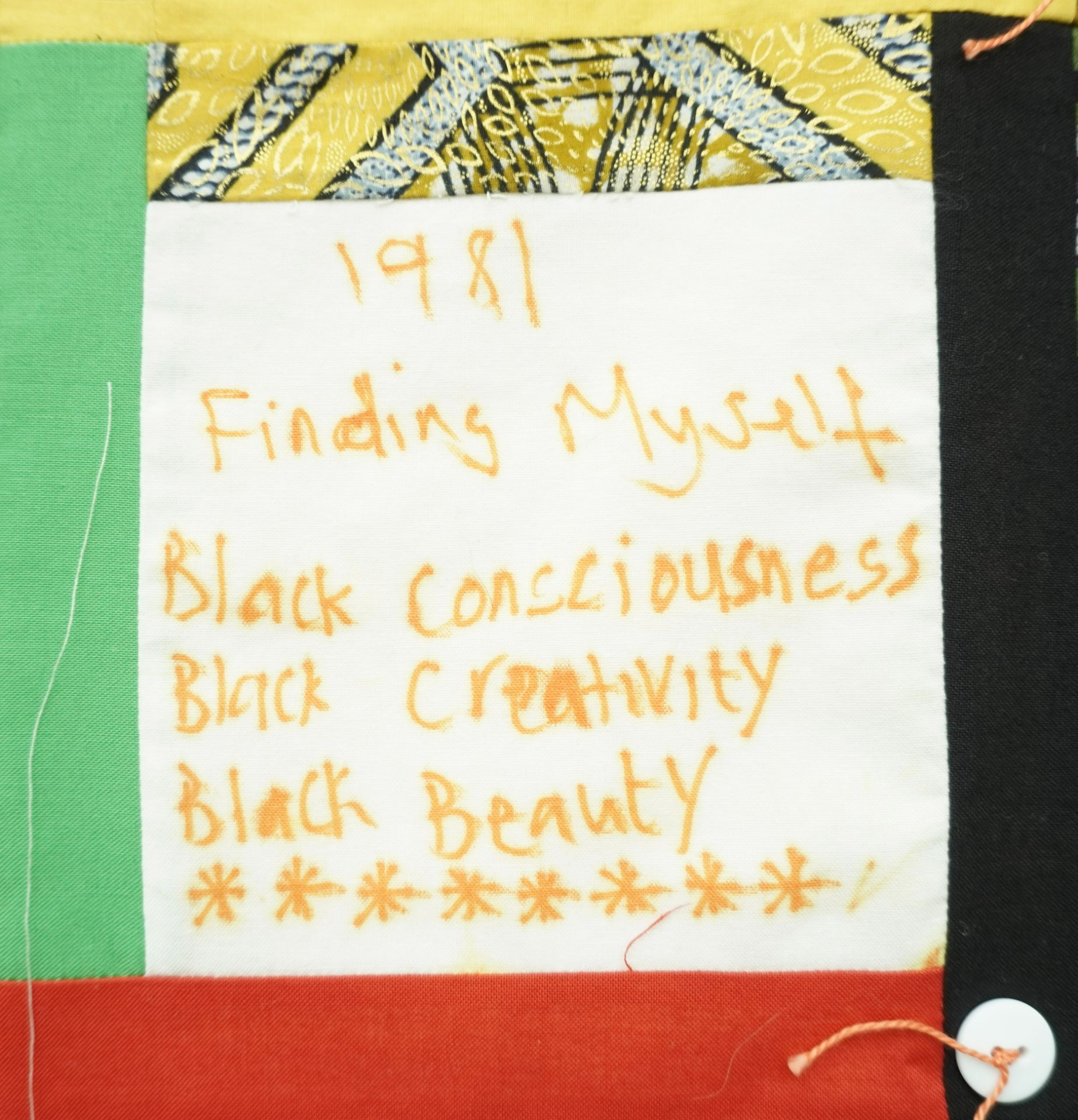 Commemorative quilt. Text reads, '1981 Finding myself. black consciousness, black creativity, black beauty'