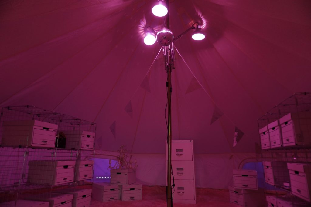 The inside of a pink tent