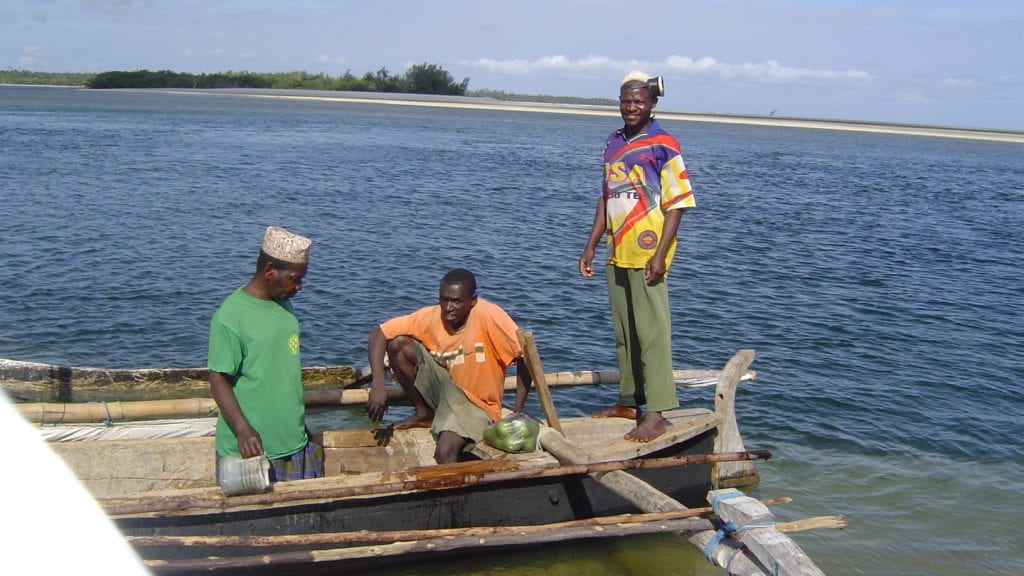 Fishermen in outrigger canoe