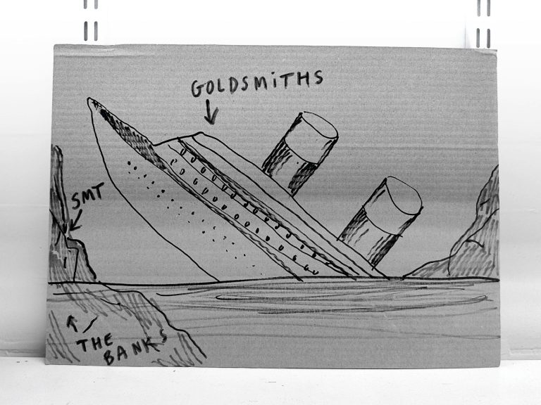 A black and white image with a drawing of a ship that looks like Titanic, which is sinking after having hit an iceberg. An arrow that says "Goldsmiths" points to the ship, while the tip of the iceberg is tagged with the acronym SMT and its underwater base with the phrase "the banks". The drawing is on a piece of cardboard standing on a shelve.
