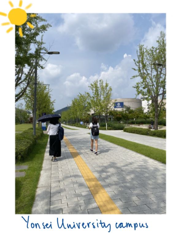 Two people walking on Yonsei University Campus