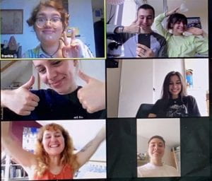 A screenshot of a zoom call between members of Seven Veils Collective. They all look into the camera and smile.