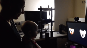 A mother and baby taking part in an eyetracking experiment